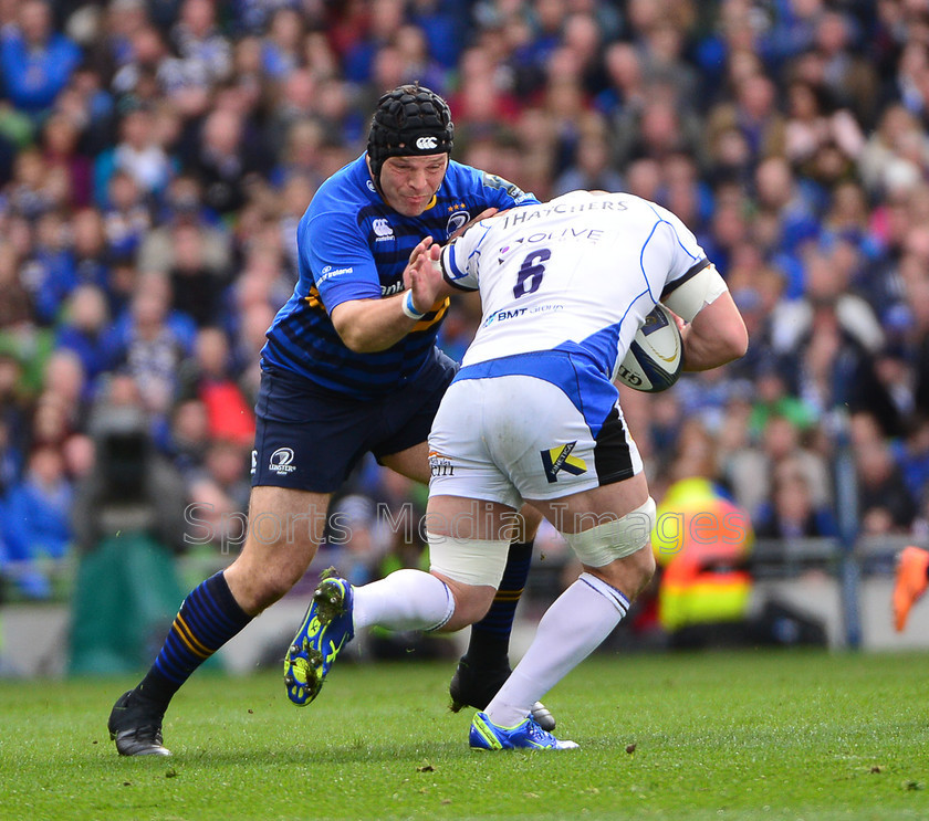 2015-04-04-Leinster-v-Bath-ERCC-0026 
 Leinsters Mike Ross, tackles Baths Carl Fearns 
 Keywords: 1 Cian Healy.
Replacements: 16 Richardt Strauss, 1 Paul James.Replacements: 16 Ross Batty, 10 George Ford, 10 Jimmy Gopperth, 11 Luke Fitzgerald, 11 Matt Banahan, 12 Ian Madigan, 12 Kyle Eastmond, 13 Ben Te'o, 13 Jonathan Joseph, 14 Fergus McFadden, 14 Horacio Agulla, 17 Jack McGrath, 17 Nick Auterac, 18 Marty Moore, 18 Max Lahiff, 19 Matt Garvey, 19 Tom Denton, 2 Rob Webber, 2 Sean Cronin, 20 Alafoti Faosiliva, 20 Dominic Ryan, 21 Eoin Reddan, 21 Peter Stringer, 22 Gordon D'Arcy, 22 Sam Burgess, 23 Tom Homer., 23 Zane Kirchner.

Bath: 15 Anthony Watson, 3 Kane Palma-Newport, 3 Mike Ross, 4 Devin Toner, 4 Stuart Hooper (c), 5 Dave Attwood, 5 Mike McCarthy, 6 Carl Fearns, 6 Jordi Murphy, 7 Francois Louw, 7 Sean O'Brien, 8 Jamie Heaslip (c), 8 Leroy Houston, 9 Isaac Boss, 9 Micky Young, Leinster: 15 Rob Kearney, Rugby, Try, attack, backs, defence, flyhalf, forwards, lineout, penalty, referee, rugby ball, rugby union, scrum, scrum half, second row, tap, try line